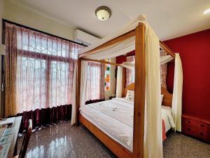 Ein Bett oder Betten in einem Zimmer der Unterkunft Village Hostel