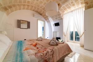 Posteľ alebo postele v izbe v ubytovaní Gioia Casa Vacanze by MONHOLIDAY