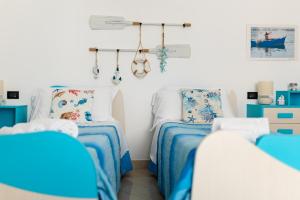 Posteľ alebo postele v izbe v ubytovaní Gioia Casa Vacanze by MONHOLIDAY