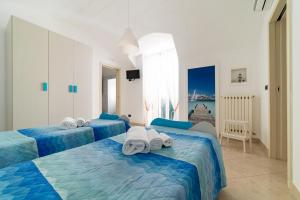 Posteľ alebo postele v izbe v ubytovaní Gioia Casa Vacanze by MONHOLIDAY