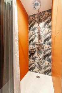 a shower in a bathroom with a shower curtain at SIX IN THE CITY Apartment, LJUBLJANA in Ljubljana +30 photos