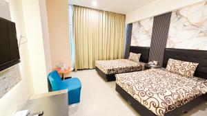 Katil atau katil-katil dalam bilik di UTC Hotel Semarang