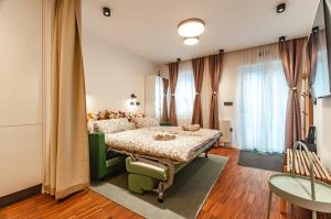 a bedroom with a bed in a room at SIX IN THE CITY Apartment, LJUBLJANA in Ljubljana