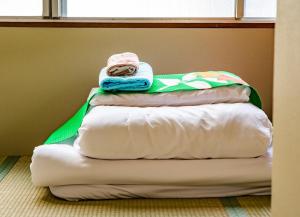 Cama o camas de una habitación en Aozora