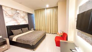 Katil atau katil-katil dalam bilik di UTC Hotel Semarang
