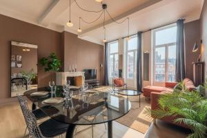 Télévision ou salle de divertissement dans l'établissement Appartement deux chambres sur la Grande Place