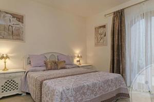 Łóżko lub łóżka w pokoju w obiekcie La Manga Club Resort - Individual Villa 559