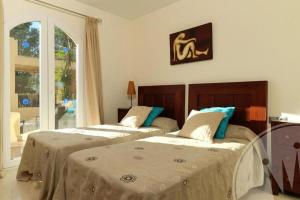 Łóżko lub łóżka w pokoju w obiekcie La Manga Club Resort - Individual Villa 559