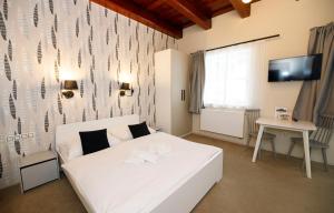Postel nebo postele na pokoji v ubytování Aparthotel Panorama