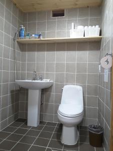 a bathroom with a toilet and a sink at Yettle Hanok Stay in Gyeongju