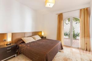 Łóżko lub łóżka w pokoju w obiekcie La Manga Club Resort - Individual Villa 524