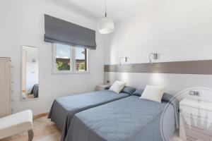 Łóżko lub łóżka w pokoju w obiekcie La Manga Club Resort - Individual Villa 524