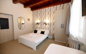 Postel nebo postele na pokoji v ubytování Aparthotel Panorama