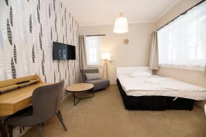 Postel nebo postele na pokoji v ubytování Aparthotel Panorama
