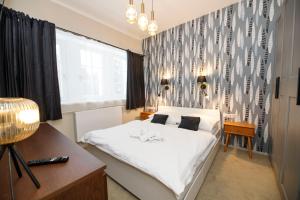 Postel nebo postele na pokoji v ubytování Aparthotel Panorama