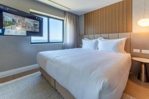 Postel nebo postele na pokoji v ubytování Seanergy Boutique & Spa Hotel