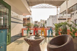 a balcony with a table and chairs and a building at Dakao Vibe Studios by CIRCADIAN in Ho Chi Minh City