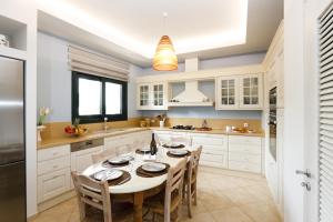 Kuchyň nebo kuchyňský kout v ubytování Aphaia Home