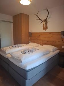 En eller flere senge i et værelse på Deluxe Alpenkrone Schladming