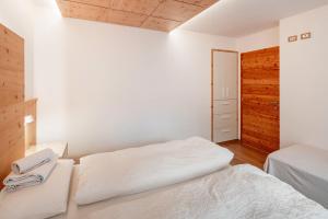 Letto o letti in una camera di Chalet Buffaure a Parte