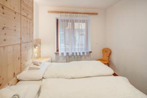 Letto o letti in una camera di Chalet Buffaure a Parte