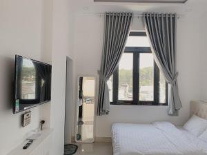 TV a/nebo společenská místnost v ubytování Diva Hotel