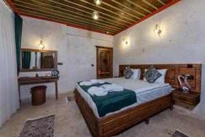 Кровать или кровати в номере Mai Cappadocia Hotel