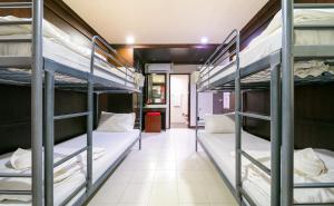 a group of bunk beds in a room at EBS Hostel Phuket, Kata Beach in Karon Beach