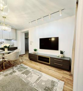 Μια τηλεόραση ή/και κέντρο ψυχαγωγίας στο Apartament Lauden