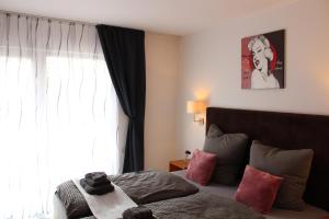 Postel nebo postele na pokoji v ubytování Burghotel - Das Original