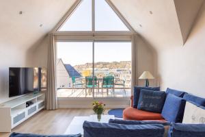 TV a/nebo společenská místnost v ubytování L'Abri Côtier d'Argäe - Terrasse vue mer