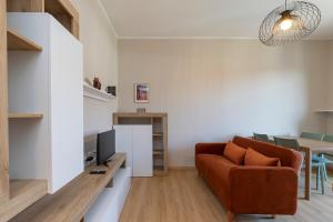 a living room with a couch and a table at I Host Apartment - Coni Zugna 58 in Milan