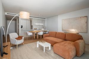 a living room with a couch and a table at Luxury in Funchal - Savoy Monumentalis II in Funchal