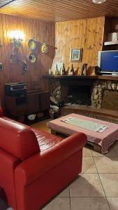 a living room with a couch and a fireplace at Casa Belvedere Leonessa in Leonessa +10 photos