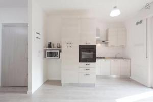 Kuchyň nebo kuchyňský kout v ubytování Residenza Borgo Trento SUNDAY