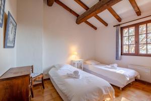 Letto o letti in una camera di Ajoucadou - Vue sur le Cap Lardier