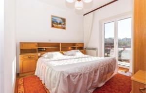 Ένα ή περισσότερα κρεβάτια σε δωμάτιο στο 2 Bedroom Stunning Apartment In Grizane