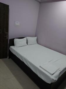 Ένα ή περισσότερα κρεβάτια σε δωμάτιο στο RAISON HOTEL +40 φωτογραφίες