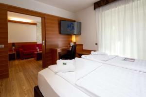 Postel nebo postele na pokoji v ubytování Best Western Hotel Adige