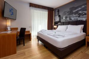 Postel nebo postele na pokoji v ubytování Best Western Hotel Adige