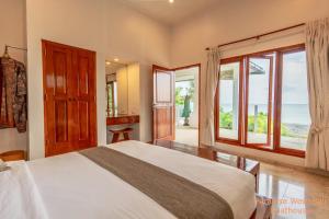Кровать или кровати в номере Paradise West-Bali