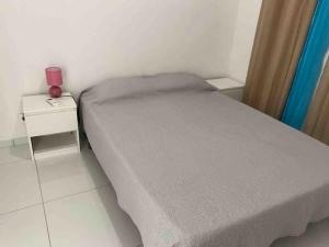 En eller flere senge i et værelse på Villa Marracuja Souffleur Beach