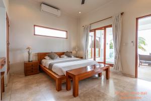 Кровать или кровати в номере Paradise West-Bali
