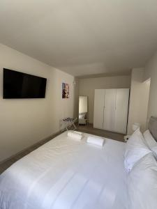 Postel nebo postele na pokoji v ubytování 7Suites