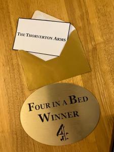 a four in a bed winner sign on a table at Thorverton Arms in Exeter