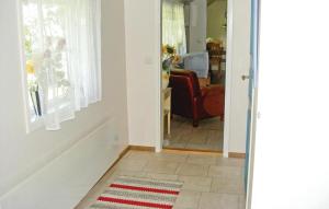 a hallway with a door leading to a living room at Pet Friendly Home In Ljungby With Wifi in Bolmstad