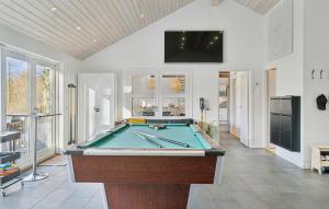 a living room with a pool table in it at Nice Home In Vejby With Sauna in Vejby