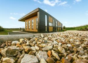 a large pile of rocks in front of a building at Goosedale Lodges in Nottingham