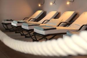 a row of mattresses lined up in a room at Hotel & Residence Hochriegel in Spiegelau +52 photos