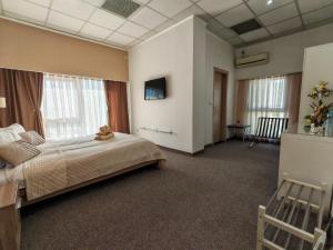 Postel nebo postele na pokoji v ubytování Aparthotel Waldinger Skopje